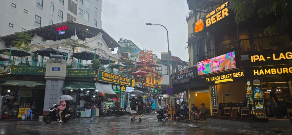 Wet street in Hanoi at dusk, Vietnam – photo: Vanja Keindl