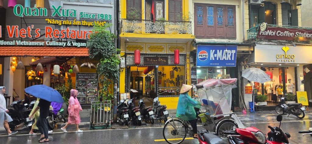 Street in Hanoi Old Quarter in the rain, Vietnam – photo: Vanja Keindl